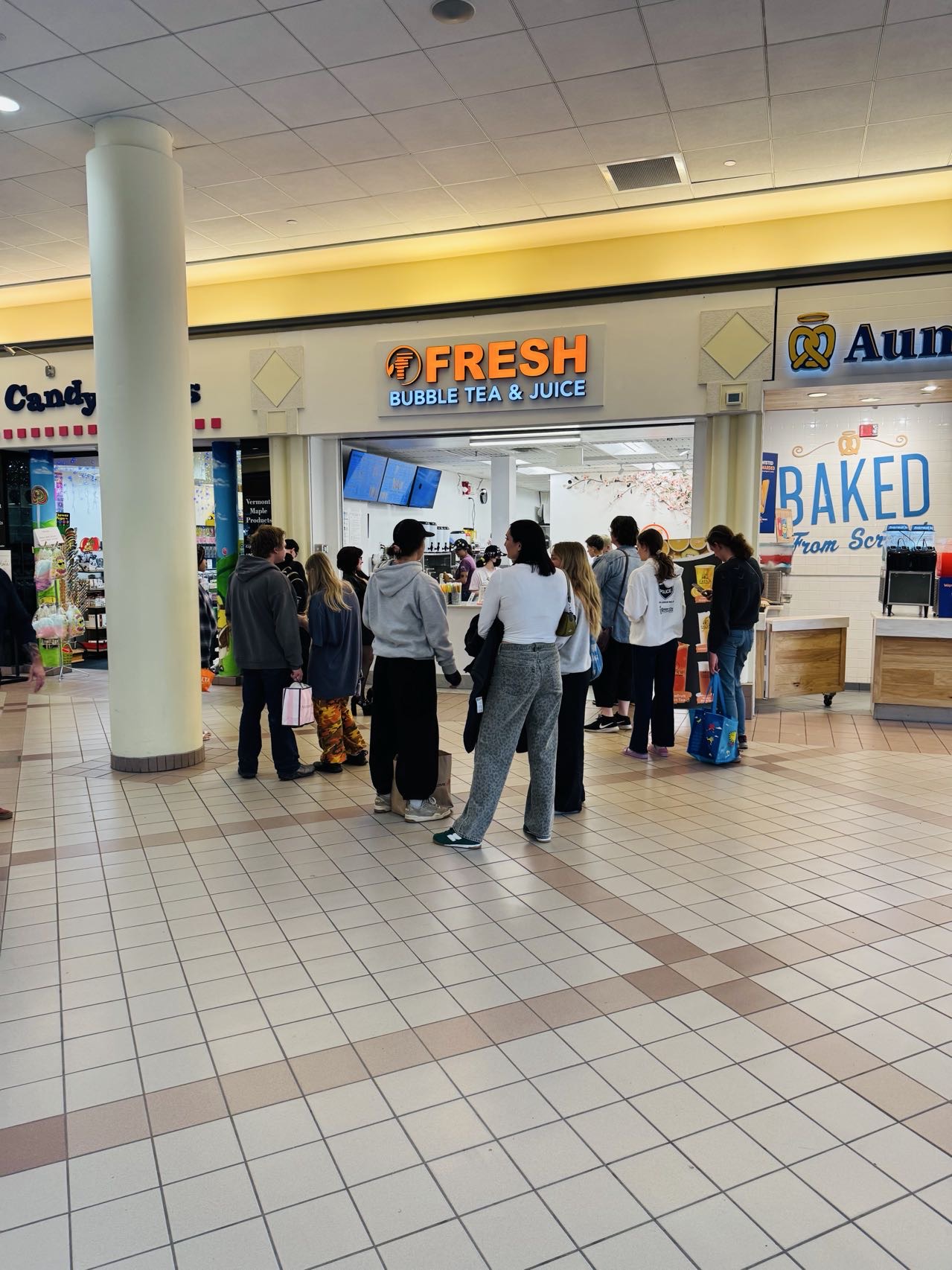 Fresh Bubble Tea & Juice storefront at University Mall with customers gathered outside