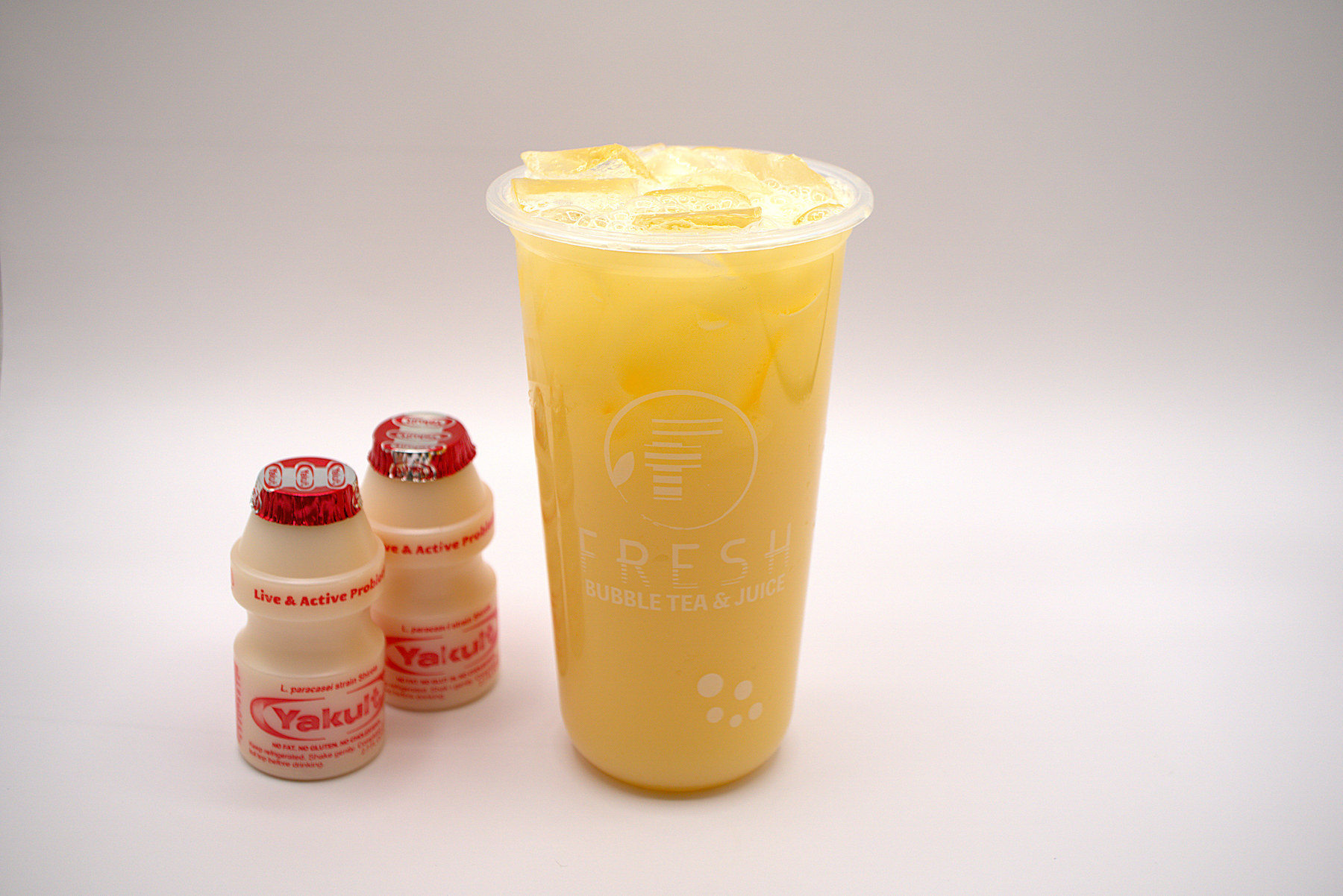 Fresh Mango Yakult probiotic yogurt drink with Yakult bottles